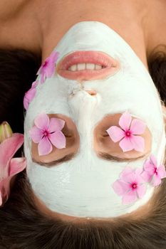 A woman with botanical mask