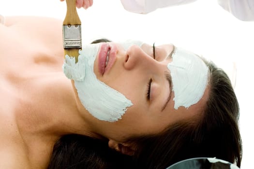 A mask is applied at a beauty salon