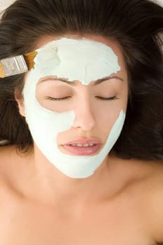 A mask is applied to a woman
