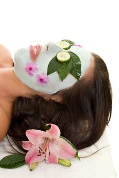 A woman with green tea and cucumber mask.