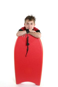 A child casually rests with his bodyboard