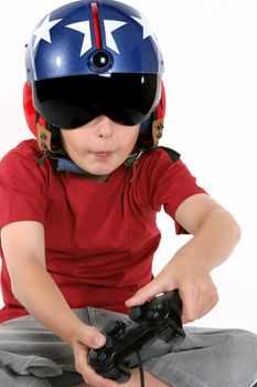 Child wearing helicopter pilot helmet with sunvisor and ear muffs, playing a flight simulator game.