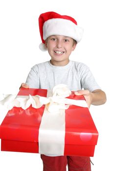 A boy gives someone a Christmas present. Focus on boy.