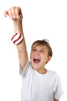 A joyous child hangs Christmas decorations