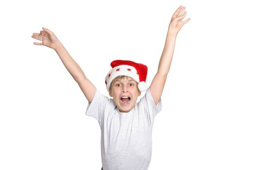 A boy leaps for joy at Christmas time.