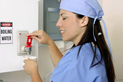 A medical healthcare worker makes a cup of tea or coffee
