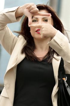Female makes a frame
