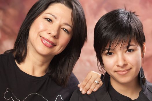 Attractive Multiethnic Mother and Daughter Studio Portrait.