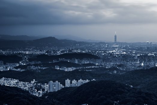 Cityscape of Taipei city night with illuminated buildings and skyline in Taiwan.
