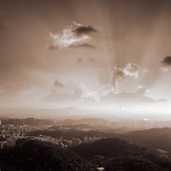 Sunset of city scenery with mountains and buildings in Taipei, Taiwan.