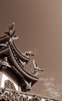 China temple with decorative roof and sky.