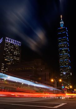 Taipei city night with famous skyscraper the 101 building and traffic cars light.