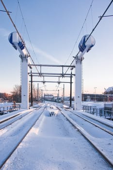 Train lifting bridge in the snow on early winter morning - vertical image