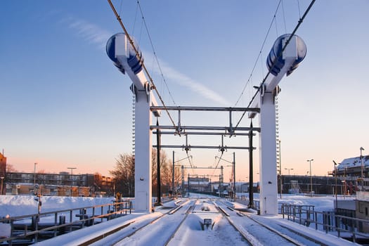 Train lifting bridge in the snow on early winter morning - horizontal image