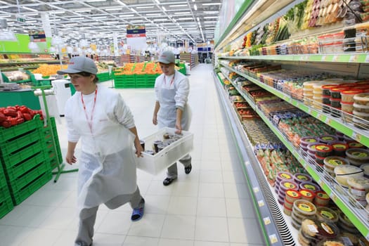 KYIV, UKRAINE - NOVEMBER 13: Worker in supermarket during preparation for the opening of the first store of OK supermarket network on November 13, 2007 in Kyiv, Ukraine.