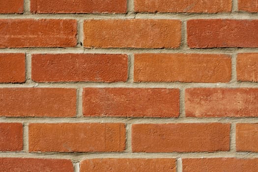 Closeup of red brick wall suitable for use as background.