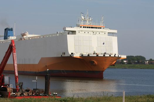 Giant boat on a canal, entering locks to the sea