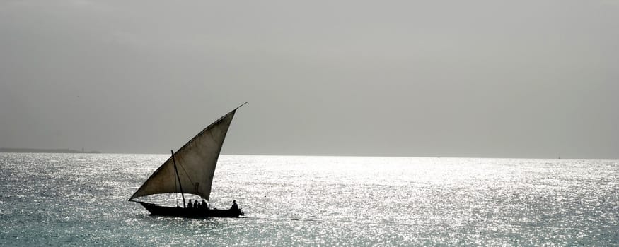 A dhow boat sailing on the coast of africa