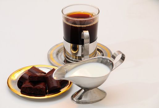 Coffee and Cream-jug for cream with fresh cream .