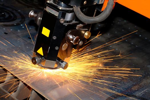 Industrial laser with sparks flying around