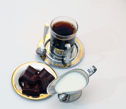 Coffee, chocolate and Cream-jug for cream with fresh cream .