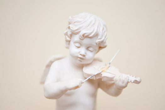 A little angel playing violin