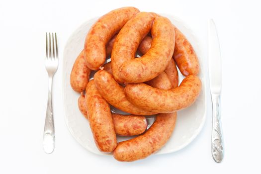 Sausages on the white plate