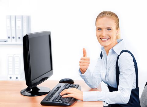 Businesswoman with thumbs up. Screen has a clipping path.