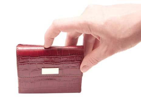 a hand holding a red purse over a white background 