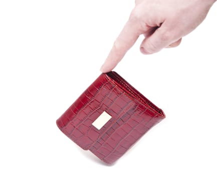 a hand holding a red purse over a white background