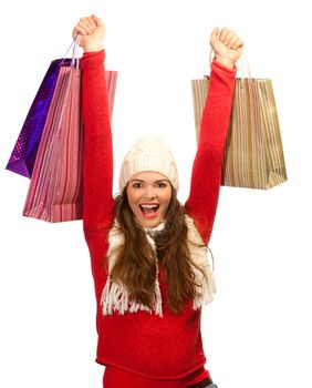 A beautiful young woman out shopping is thrilled to find the perfect christmas gift