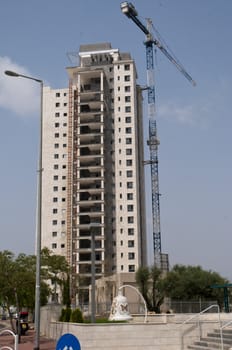 Construction of new apartment building  in progress incomplete construction.