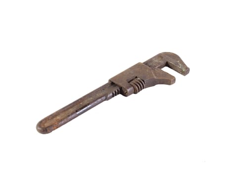 Old adjustable wrench on a plain white background.