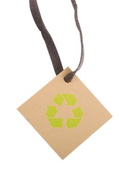tan tag and green recycling sign on white background 