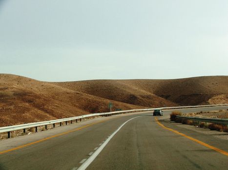 A view of an empty highway road .