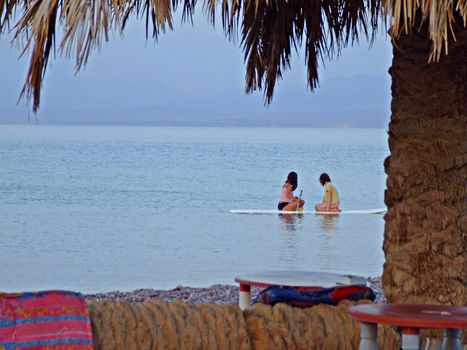 Red Sea. Sinai. Egypt. Two girls sitting in a canoe.