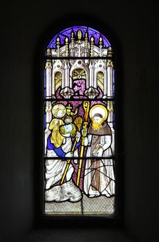 Historic stained glass window, christian theme.