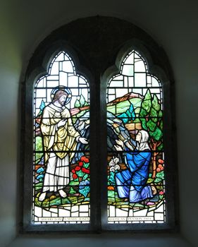 Historic stained glass window, christian theme.