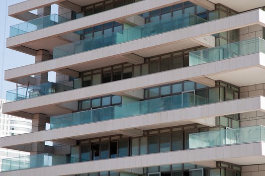 Part of a new tower with blue windows .