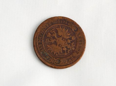 Age-old Russian coin on a white background .