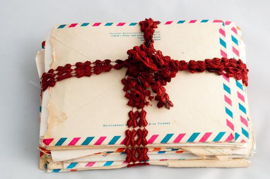 Pile of old letters in post envelopes, as a symbol of memoirs and time .