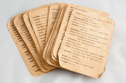 Open the old religious books with text on the old-Slavic language, isolated on a white background. The book is not binding, page view postcards.
