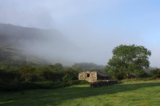 Mist rolling up a valley