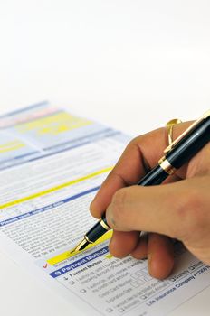 Vertical image of man signing application form using pen