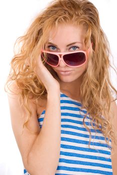 Redheaded woman in striped vest and pink glasses over white