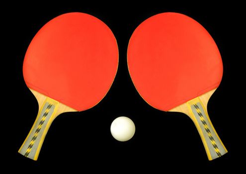 Table tennis double paddle and ball over black