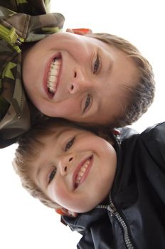 two cute young boys with a teethy smile