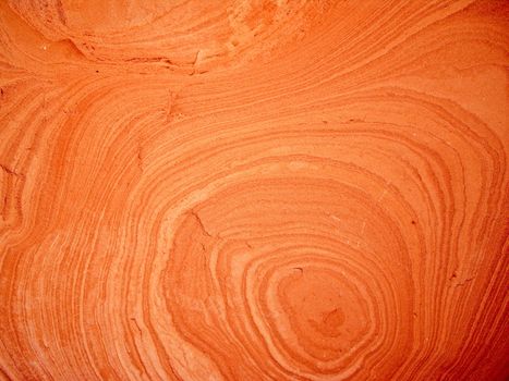 Swirls and circles form in soft sandstone