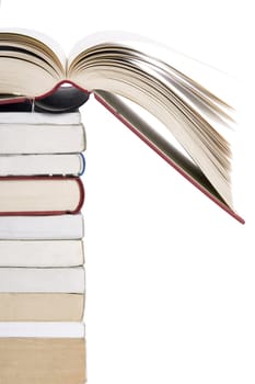 color tower books with open one arranged in stack