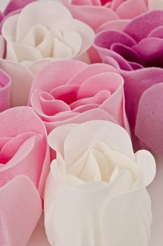 Pink, purple and white beautiful luxury soap roses background.